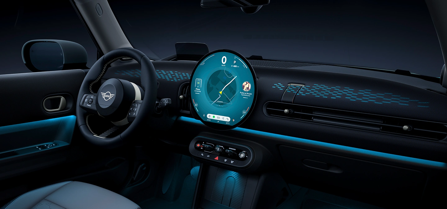 View of the interior of the MINI Cooper with ambient light in blue.